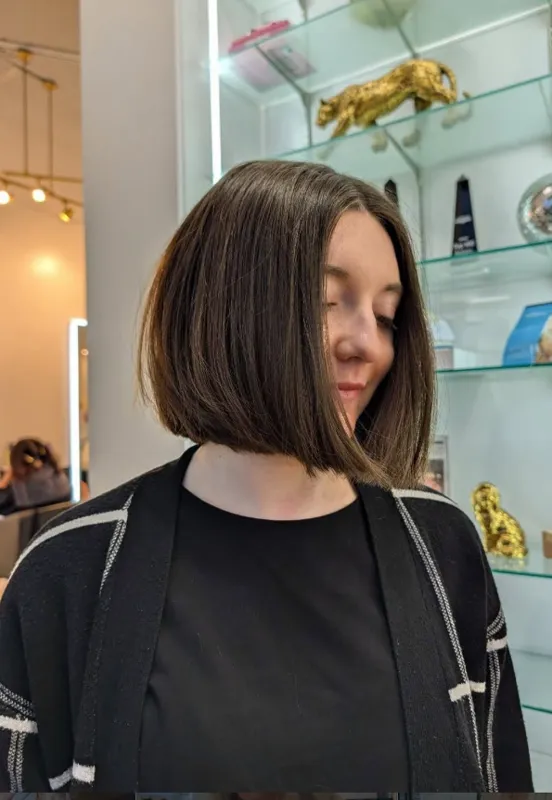 Sleek chin-length brunette bob haircut at Christina White Salon