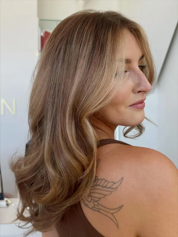 Honey brown balayage with face-framing layers by Christina White Salon
